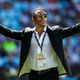 Salt Bae with arms extended in front of a crowd